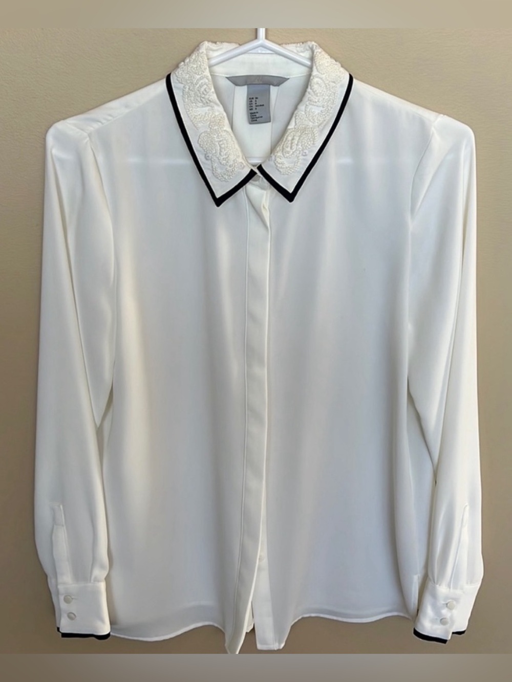 H&M White Button-Down Blouse with Embroidered Collar and Black Trim